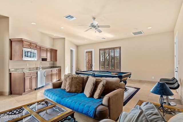 living area featuring visible vents, light tile patterned flooring, and pool table