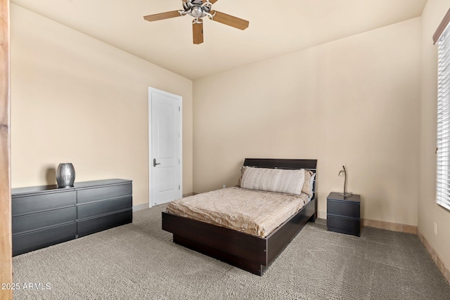 bedroom with baseboards, carpet floors, and ceiling fan