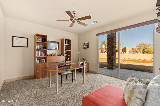 office space with baseboards, visible vents, carpet floors, and ceiling fan