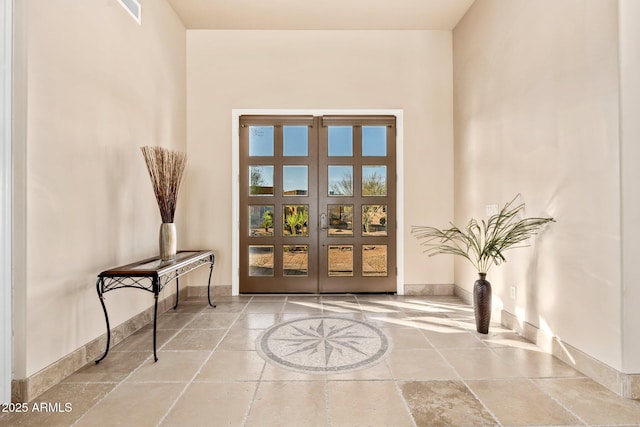 property entrance featuring french doors and visible vents