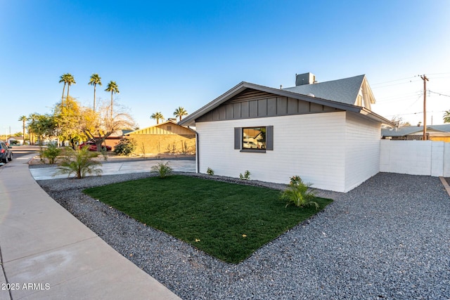 view of home's exterior with a yard