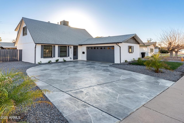 modern inspired farmhouse with a garage