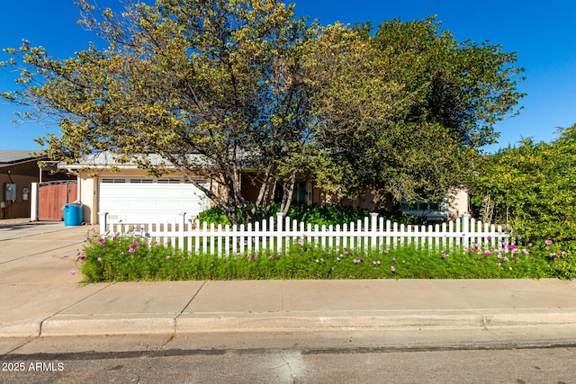 obstructed view of property featuring a garage