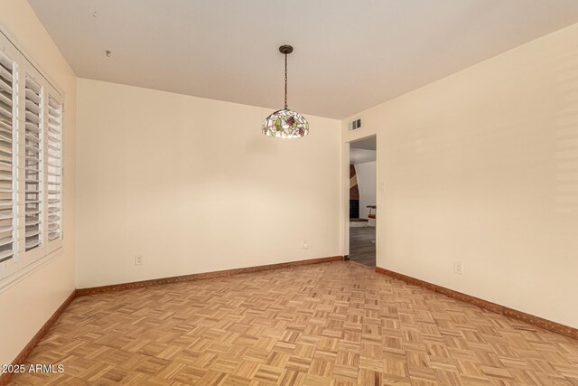 spare room with light parquet floors