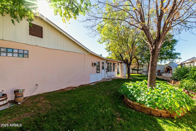 view of side of home featuring a yard