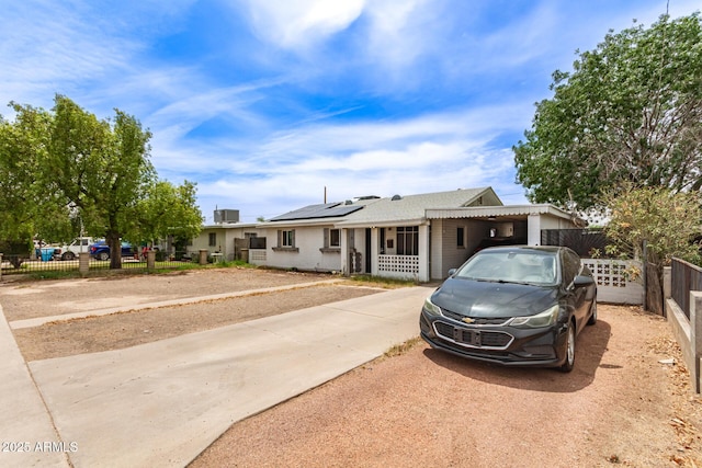 2801 W Glenrosa Ave, Phoenix, AZ 85017 - view of front of property with solar panels, driveway, and roof with shingles