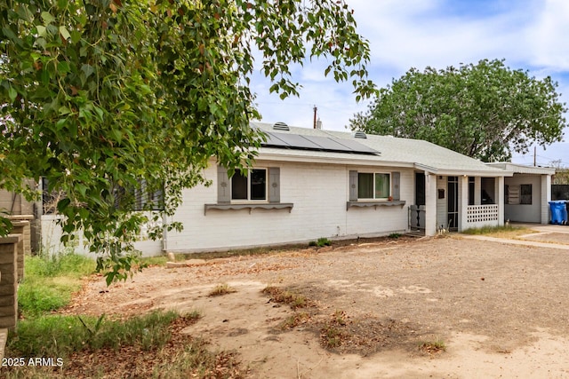 2801 W Glenrosa Ave, Phoenix, AZ 85017 - view of front of home with roof mounted solar panels, brick siding, and roof with shingles