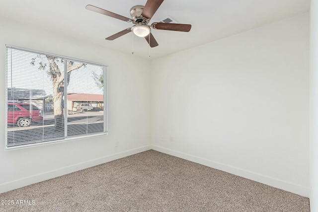 carpeted empty room with ceiling fan