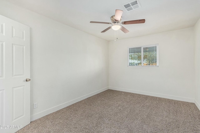 empty room featuring carpet floors and ceiling fan