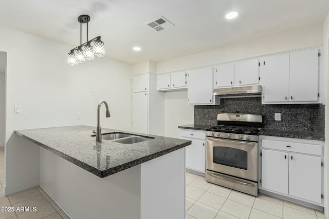 kitchen featuring white cabinets, sink, decorative light fixtures, light tile patterned flooring, and stainless steel range with gas stovetop