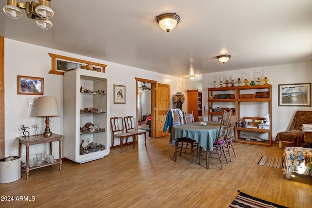 1528 Black Canyon Rd, Heber, AZ 85928 - dining room with light wood-style flooring and a chandelier
