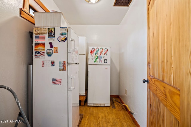 1528 Black Canyon Rd, Heber, AZ 85928 - kitchen with freestanding refrigerator, light wood-style floors, and baseboards