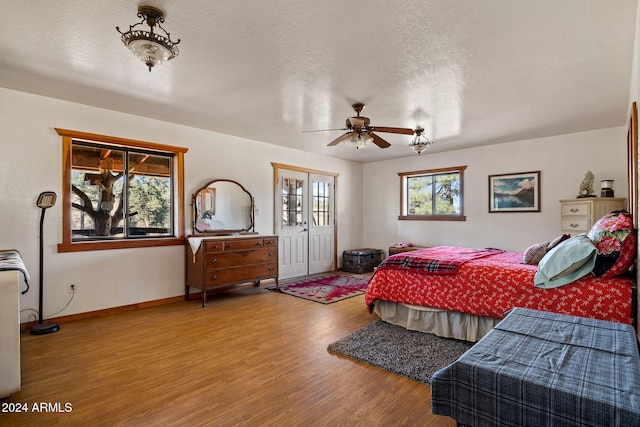 1528 Black Canyon Rd, Heber, AZ 85928 - bedroom with wood finished floors, baseboards, and a ceiling fan