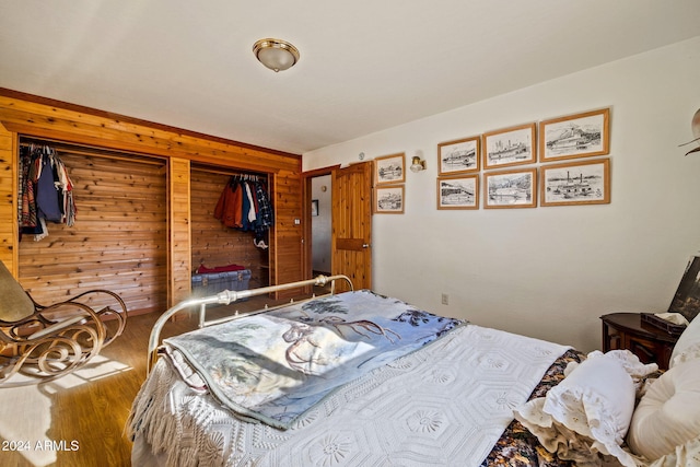 1528 Black Canyon Rd, Heber, AZ 85928 - bedroom with wooden walls, wood finished floors, and a closet
