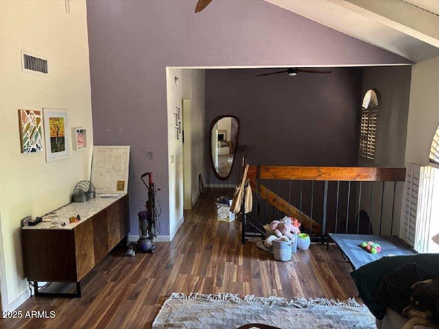 319 E Coronado Rd Unit 1, Phoenix, AZ 85004 - living area featuring ceiling fan, wood finished floors, vaulted ceiling, and baseboards