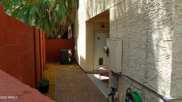 319 E Coronado Rd Unit 1, Phoenix, AZ 85004 - view of home's exterior with central air condition unit, a fenced backyard, stucco siding, and a patio area