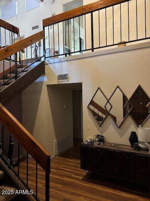 319 E Coronado Rd Unit 1, Phoenix, AZ 85004 - stairs featuring wood finished floors and a high ceiling