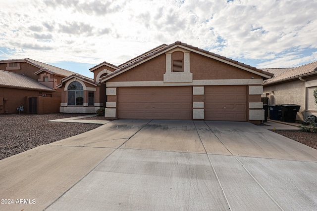 single story home featuring a garage