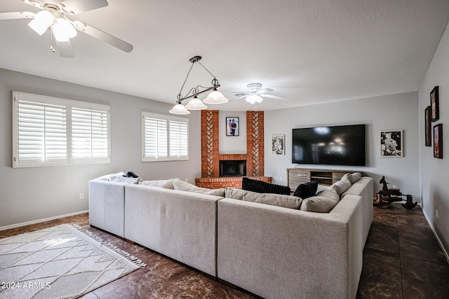 living room with a brick fireplace and ceiling fan