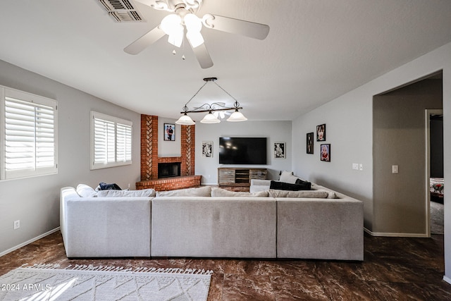 living room featuring a fireplace and ceiling fan