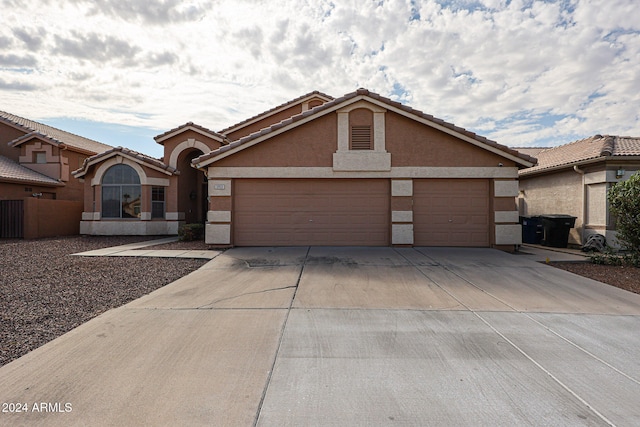 ranch-style home with a garage