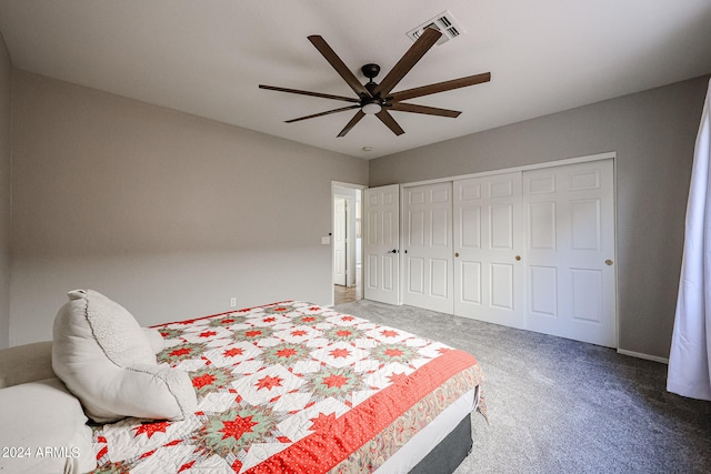 carpeted bedroom featuring a closet and ceiling fan