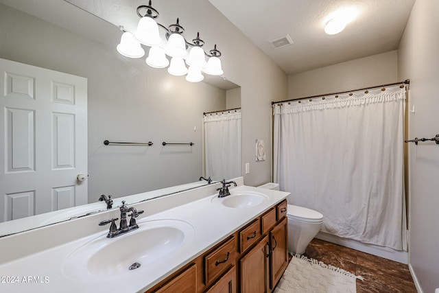 bathroom featuring vanity, toilet, a shower with shower curtain, and a textured ceiling