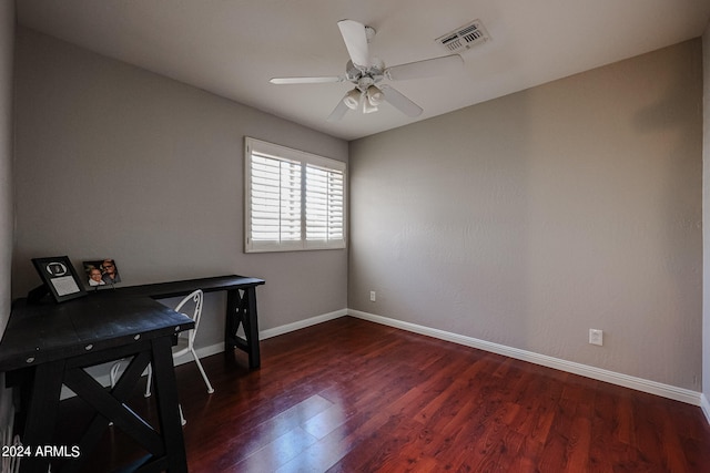 home office with dark hardwood / wood-style floors and ceiling fan