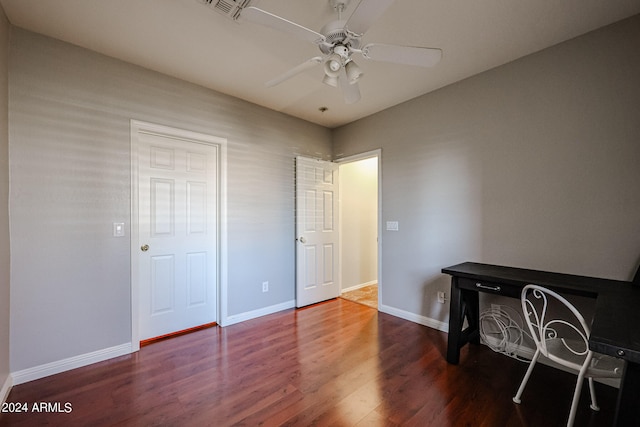 home office featuring wood-type flooring and ceiling fan