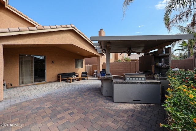 view of patio with ceiling fan and an outdoor hangout area