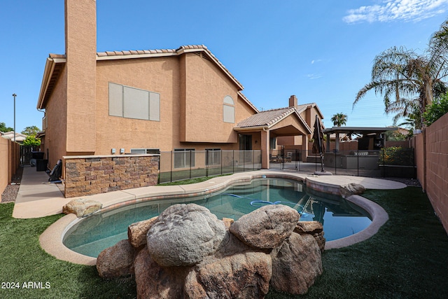 view of swimming pool with a patio and a lawn