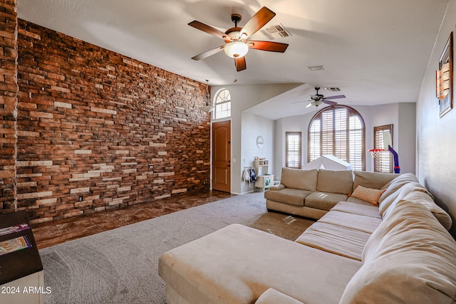 living room featuring lofted ceiling, dark carpet, and ceiling fan