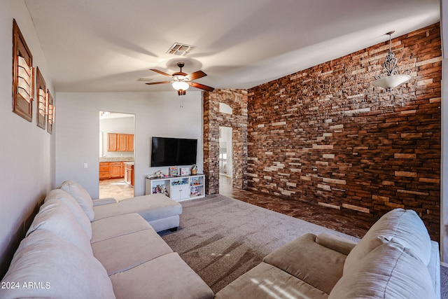 living room with vaulted ceiling and ceiling fan