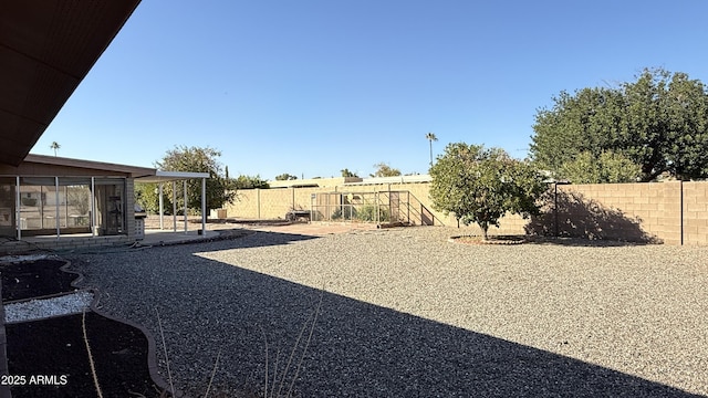 view of yard featuring a patio and a fenced backyard