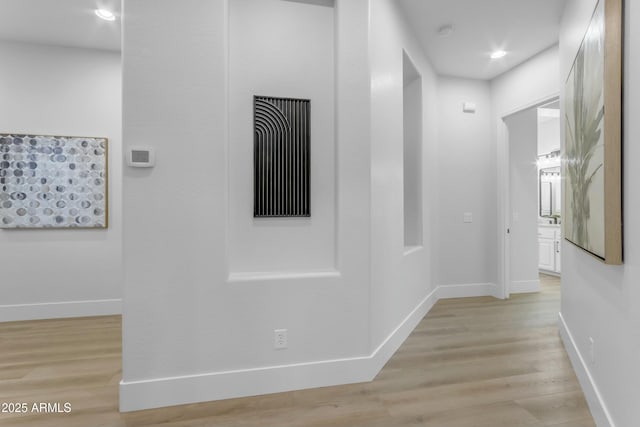 hallway featuring light hardwood / wood-style flooring