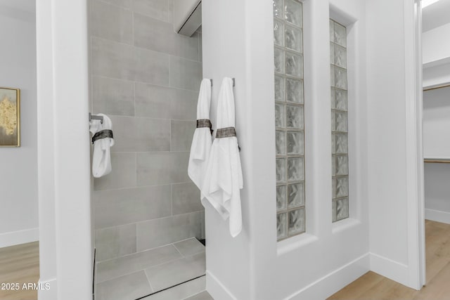 bathroom with hardwood / wood-style flooring