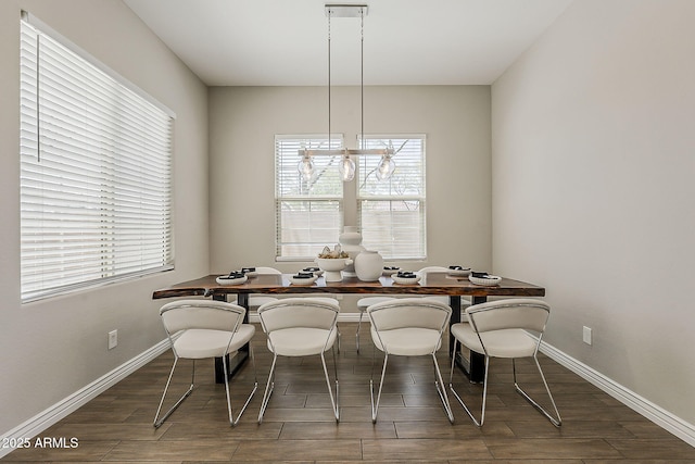 3310 E Los Gatos Dr, Phoenix, AZ 85050 - dining room featuring plenty of natural light, a desk, wood finished floors, and baseboards
