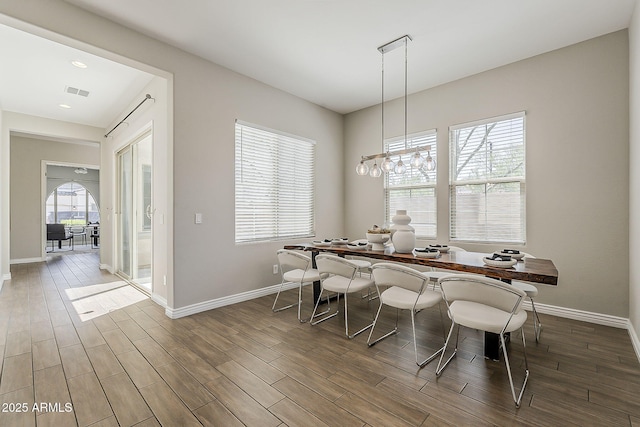3310 E Los Gatos Dr, Phoenix, AZ 85050 - dining room with wood finished floors, baseboards, and recessed lighting