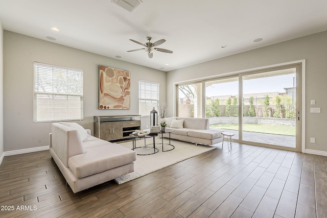 3310 E Los Gatos Dr, Phoenix, AZ 85050 - living area featuring a ceiling fan, baseboards, wood finished floors, and recessed lighting