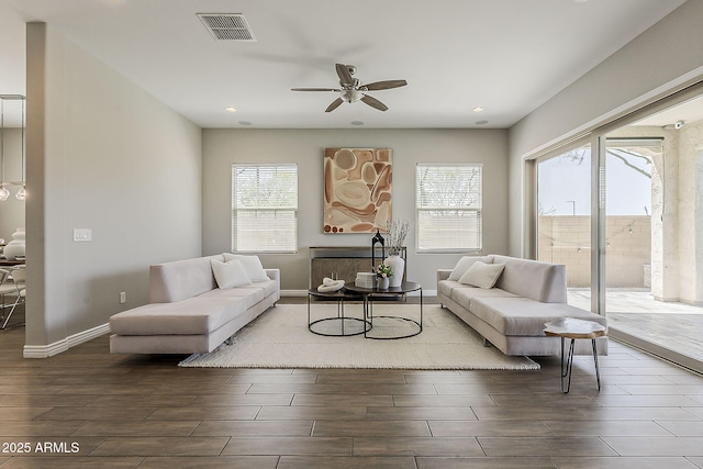 3310 E Los Gatos Dr, Phoenix, AZ 85050 - living room featuring wood tiled floors, a ceiling fan, recessed lighting, and baseboards