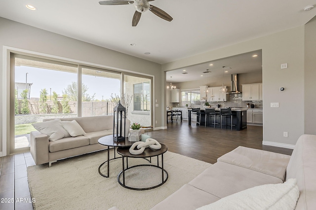 3310 E Los Gatos Dr, Phoenix, AZ 85050 - living area featuring a ceiling fan, dark wood-style flooring, baseboards, and recessed lighting