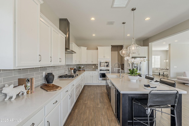 3310 E Los Gatos Dr, Phoenix, AZ 85050 - kitchen featuring stainless steel appliances, light countertops, recessed lighting, tasteful backsplash, and white cabinetry