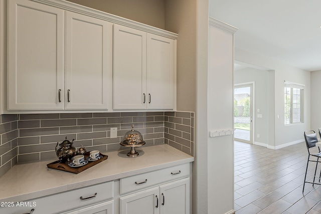 3310 E Los Gatos Dr, Phoenix, AZ 85050 - kitchen with backsplash, baseboards, and light countertops