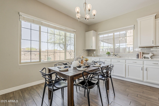 3310 E Los Gatos Dr, Phoenix, AZ 85050 - dining area with healthy amount of natural light, light wood-style floors, a chandelier, and baseboards