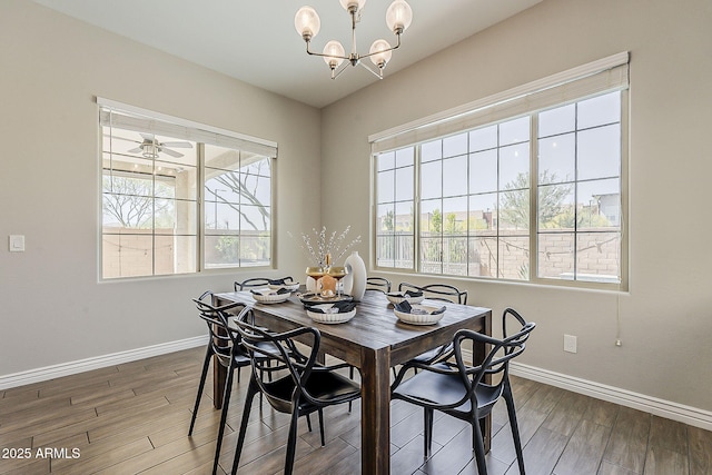 3310 E Los Gatos Dr, Phoenix, AZ 85050 - dining area featuring baseboards, healthy amount of natural light, wood finished floors, and a chandelier