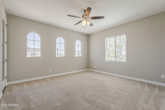 3310 E Los Gatos Dr, Phoenix, AZ 85050 - empty room featuring baseboards, carpet floors, and ceiling fan