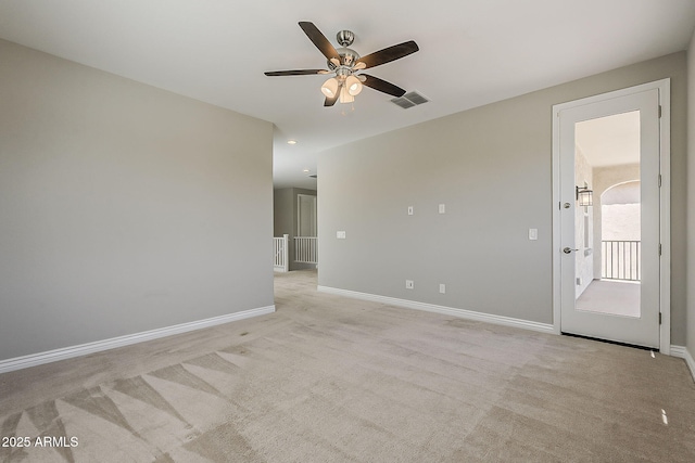 3310 E Los Gatos Dr, Phoenix, AZ 85050 - spare room with a ceiling fan, light colored carpet, and baseboards