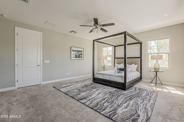 3310 E Los Gatos Dr, Phoenix, AZ 85050 - carpeted bedroom featuring multiple windows, baseboards, and ceiling fan