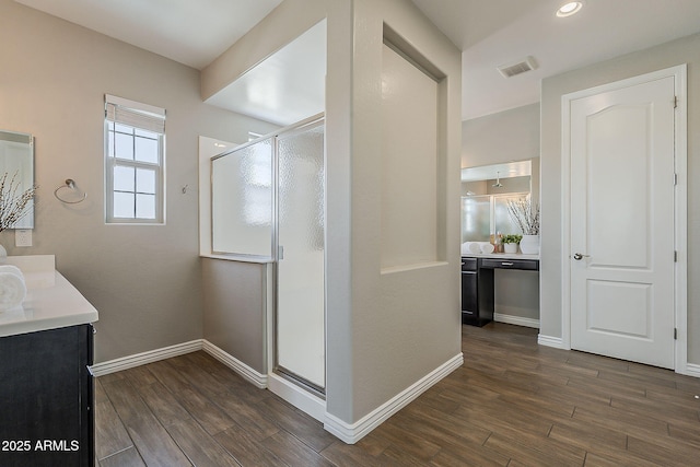 3310 E Los Gatos Dr, Phoenix, AZ 85050 - full bath with vanity, wood finished floors, a stall shower, baseboards, and recessed lighting