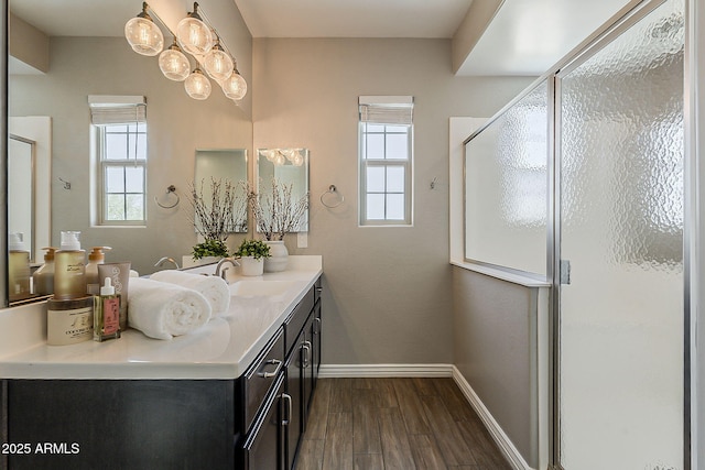 3310 E Los Gatos Dr, Phoenix, AZ 85050 - full bathroom featuring baseboards, wood finished floors, plenty of natural light, and vanity